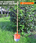 Beefy 55-Inch Black Locust Shovel Handle Replacement leaning against shrub in garden scene