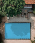 Aerial view of pool covered with Heavy Duty Waterproof Tarp 20x30 Feet 12 Mil Thick Blue UV Resistant Multipurpose Cover