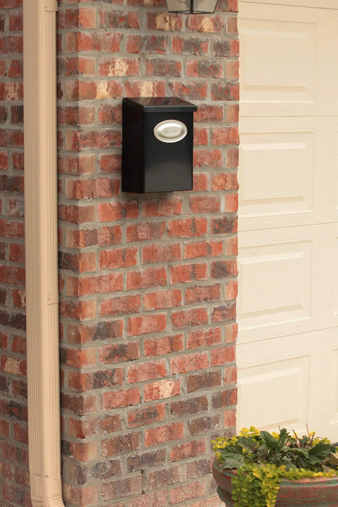 Locking Wall Mount Mailbox In Black Galvanized Steel With Medium Capacity on brick wall, heavy duty powder coated finish, weather resistant.