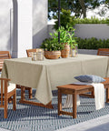 Outdoor Tablecloth With Umbrella Hole, Rectangular 60x84 Inches, Linen Look Polyester Patio Table Cover, Natural Color on a patio setup