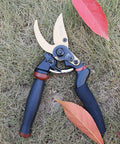8.5 Inch Rotating Bypass Pruning Shears With Titanium Coated SK5 Blade, Heavy Duty Garden Pruners on grass with fallen leaves