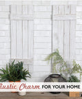 Weathered White Barn Door Shutter Wall Decor For Farmhouse Style Rustic Indoor Shutters With Barn Wood Charm Cozy Interior Wall Art From Family Owned American Shop displayed against brick wall with plants.
