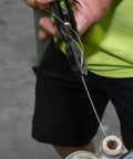 Heavy Duty Safety Wire Pliers With Reversible Twist Action for Cars Machinery and Aircraft, shown gripping and twisting wire.
