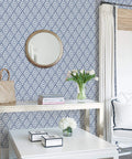 Arrowhead Deep Peel And Stick Wallpaper In Blue For Totally Easy DIY Decor in a modern living room with a geometric pattern wall.