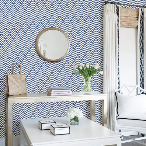 Arrowhead Deep Peel And Stick Wallpaper In Blue For Totally Easy DIY Decor in a modern living room with a geometric pattern wall.