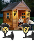 Solar Wall Lanterns Two Pack, Waterproof Decorative Solar Powered Lights For Playhouses, illuminating a wooden playhouse at night