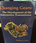 Cover of 'Changing Gears' book showing car transmission illustration on navy background.