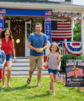 Family celebrating outside with All American 250th Anniversary Garden Flag For Outdoor Use One Nation Under God Cross Design