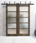 Quadro 4002 Interior Barn Bypass Sliding Doors with Frosted Glass and MDF in Black Modern Style hardware installed in living room.