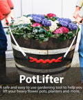 PotLifter plant mover lifting a barrel-style wooden planter filled with hydrangeas; white straps and a red center handle