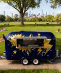 No Fuss Commercial Hot Dog Truck Trailer With Stainless Steel Catering Cart parked in a green park, showcasing built in grill.