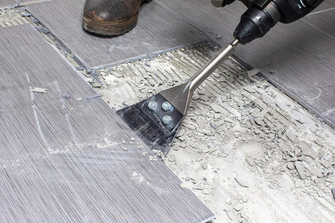 5 In. By 11 In. SDS-Plus Bulldog Floor Scraper With Durable Steel Blade removing tile, showing bolt locking attachment
