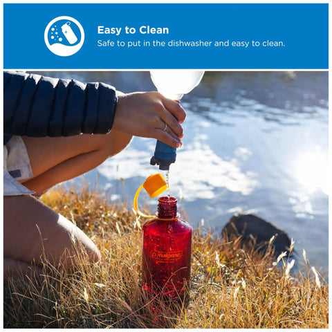 Person filling 32 Ounce Narrow Mouth Water Bottle BPA Free Durable Leak Proof Lightweight For Hiking Gym Travel And Everyday Use Amethyst Color by a lake