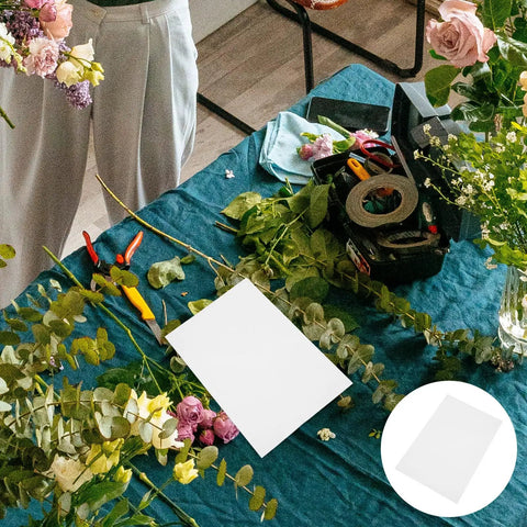 Boss Grade Flower Wrapping Paper Kit 200 Pieces 21x14 CM White Paper for florists on a table with floral tools and flowers