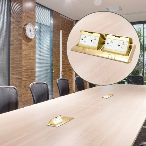 Dual Pop-Up Floor Box Kit With Brass Cover, 8.68 x 4.81 Inch Opening, 20A Tamper-Resistant Receptacles installed on boardroom table.