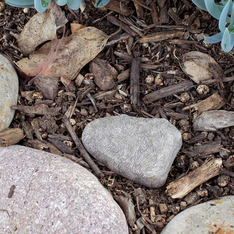 Rock Key Hider Faux Stone With Hidden Slot For Spare Keys in garden, medium size, blends into surroundings
