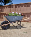 Five Cubic Foot Heavy Duty Garden Cart With 15 Inch Flat Free Tire For Gardening Planting And Outdoor Projects shown with flowers