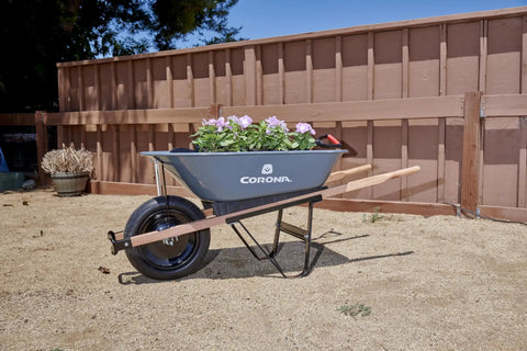 Five Cubic Foot Heavy Duty Garden Cart With 15 Inch Flat Free Tire For Gardening Planting And Outdoor Projects shown with flowers