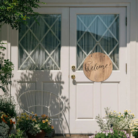 Six Round Sublimation Door Hanger Blanks For DIY Wall Decor displayed on white door with "Welcome" text, enhancing entryway.
