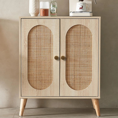 Wooden cabinet with cane paneling and two antique brass knobs, fits the style of Antique Brass Cabinet Knob And Drawer Pulls Set.