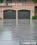 Heavy Duty Solvent Based Acrylic High Gloss Wet Look Cure And Seal For Concrete And Pavers 5 Gallon on a driveway with a wet-look finish.