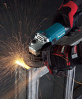 Powerful 4-1/2 Inch Angle Grinder With Kick Butt Strength cutting metal, sparks flying, ergonomic grip, lightweight build.