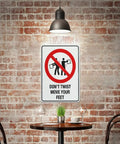 Dont Twist Move Your Feet Safety Instruction Sign 8x12 Aluminum on brick wall in industrial setting
