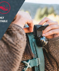 Person attaching bell to backpack with Frontiersman Max Bear Spray Kit With 7.9 Oz Deterrent, 40 Ft Range, 2 Percent Capsaicinoids, Belt Holster