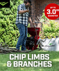 Person using Heavy Duty 212cc 4 Cycle Chipper Shredder With 20 To 1 Reduction Turns Branches Up To 3 Inches Into Mulch in garden