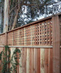 Wooden fence with trellis top supported by Deck Drive Wood Screw Type 316 Stainless Flat Head Number Ten X Two And A Half Inch.