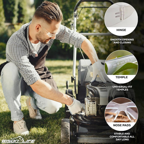 Man wearing Bulk Six Pack Clear Lens Safety Glasses ANSI Z87 1 Certified, fixing a lawn mower outdoors.