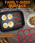 Bakers Friend 2 In 1 Electric Indoor Griddle And Grill With Reversible Non Stick Plate Silicone Mold cooking eggs and bacon on griddle.