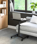 On Wheels Height Adjustable Laptop Desk For Home Office And Classroom Use, A Mobile Sit Stand Workstation next to sofa