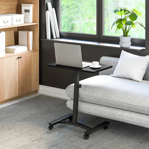 On Wheels Height Adjustable Laptop Desk For Home Office And Classroom Use, A Mobile Sit Stand Workstation next to sofa