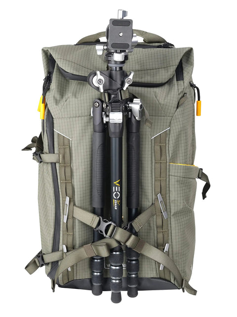 Active 53 Camera Backpack With Front Rear And Top Access For Gear Built In USB Charger Port For Power Bank Removable Camera Box Insert Versatile For Photo Video Gear And Outdoor Travel In Khaki Green, front view with tripod attached.
