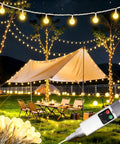 Rechargeable Camping String Lights 33Ft 100 LED Globe Bulbs Warm White With Timer illuminating a campsite with trees and tent.