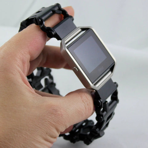 Hand holding watch with Watch Adapter For TREAD And TREAD LT Black Easy Swap Kit, 38mm case, black link band, close-up view.