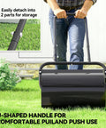 Person uses 20 Inch Push And Tow Behind Lawn Roller Filled With 10 Gallons Of Water Or Sand, Heavy Duty Yard Roller in garden, black