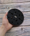Hand holding 6 Inch 17 Hole Sanding Disc Pad For Hook And Loop Backing Sander Replacement Pad Compatible With BO6030 BO6040 Festool