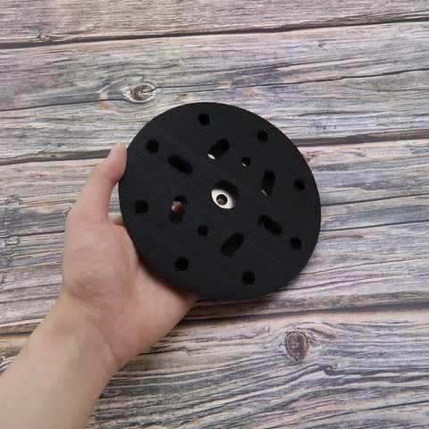Hand holding 6 Inch 17 Hole Sanding Disc Pad For Hook And Loop Backing Sander Replacement Pad Compatible With BO6030 BO6040 Festool