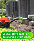 AC Drain Line Cleaner Adapter evacuating and unclogging PVC HVAC drain lines with a see-through tube connected to a wet-vac