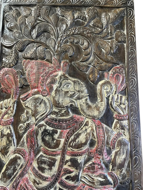 Close-up of the Indian Ganesha motif on a Slick Vintage Carved Wood Barn Door Panel, showcasing intricate craftsmanship and details.