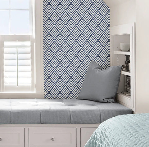 Arrowhead Deep Peel And Stick Wallpaper In Blue for Totally Easy DIY Decor on accent wall behind reading nook.