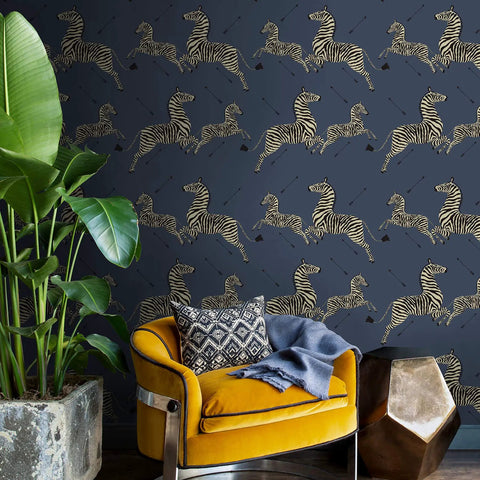 Living room with Blue Denim Zebra Safari Peel And Stick Wallpaper, yellow chair, and plant