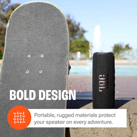 Flip 6 Bluetooth Speaker Bundle With Divvi Protective Hardshell Case next to skateboard outdoors by pool