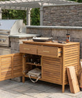 Outdoor Acacia Wood Storage Cabinet With Two Drawers And Double Door Shelf For Garden Poolside And Patio Weather Resistant Natural Finish Durable Outdoor Cabinet For Easy Grab Storage And Quick Access with open doors showing shelves and grilling tools