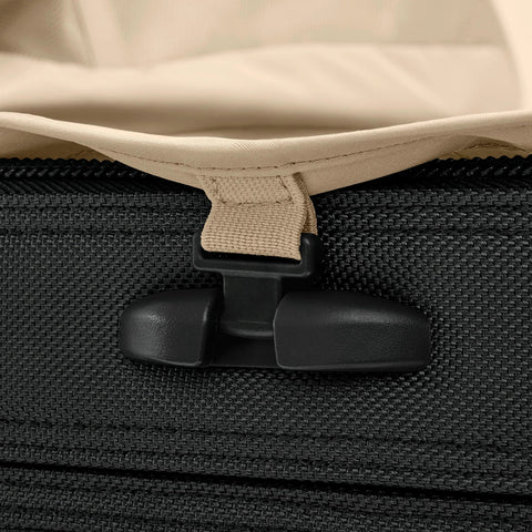 Briggs & Riley Baseline luggage: close-up of black zipper pull with beige strap on softside bag
