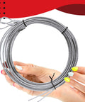 Person holding coiled cable from All In One DIY Friendly Garage Door Cable Replacement Kit With One Eighth Inch And Three Thirty Second Inch Galvanized Aircraft Cables Three Inch Pulleys And Fourteen Piece Hardware Set For Easy Extension Spring Garage Door Repair.