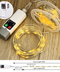 Camping String Lights 33Ft Long With 100 LEDs Rechargeable Outdoor Lights Waterproof USB Powered For Power Bank Or Adapter 13 Modes Warm White Cozy Vibe For Tent Awning Garden Patio And Travel Decor, coiled and plugged into USB power bank on wooden surface