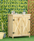 Built Tough 32 Inch Workshop Cabinet With Rust Resistant Galvanized Top And Dual Wooden Shelves For Heavy Duty Tool Chest And Real Deal Farmhouse Garage Storage against green wall with potted plants.